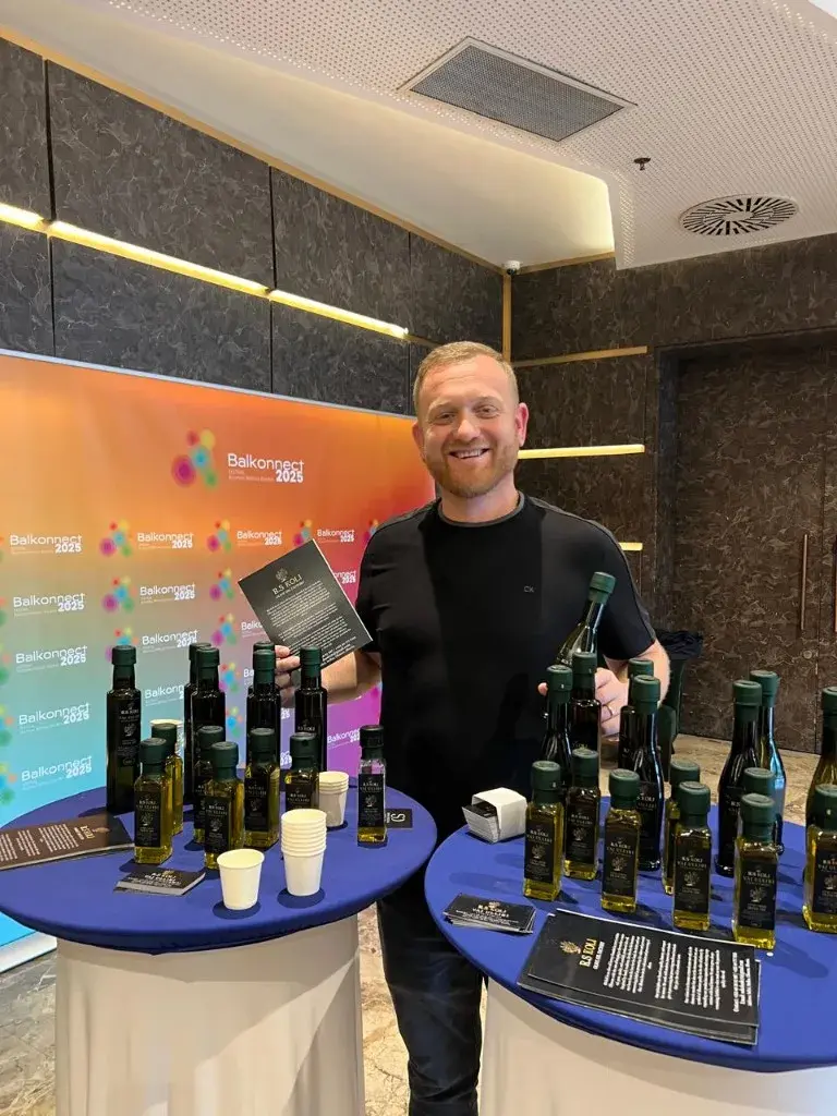 R.S KOLI olive oil tasting tables at Balkonnect Festival with Business Without Borders banner